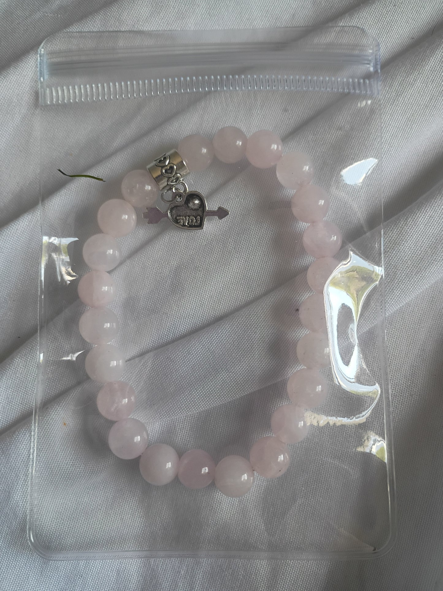 Rose quartz energy bracelet with heart charm
