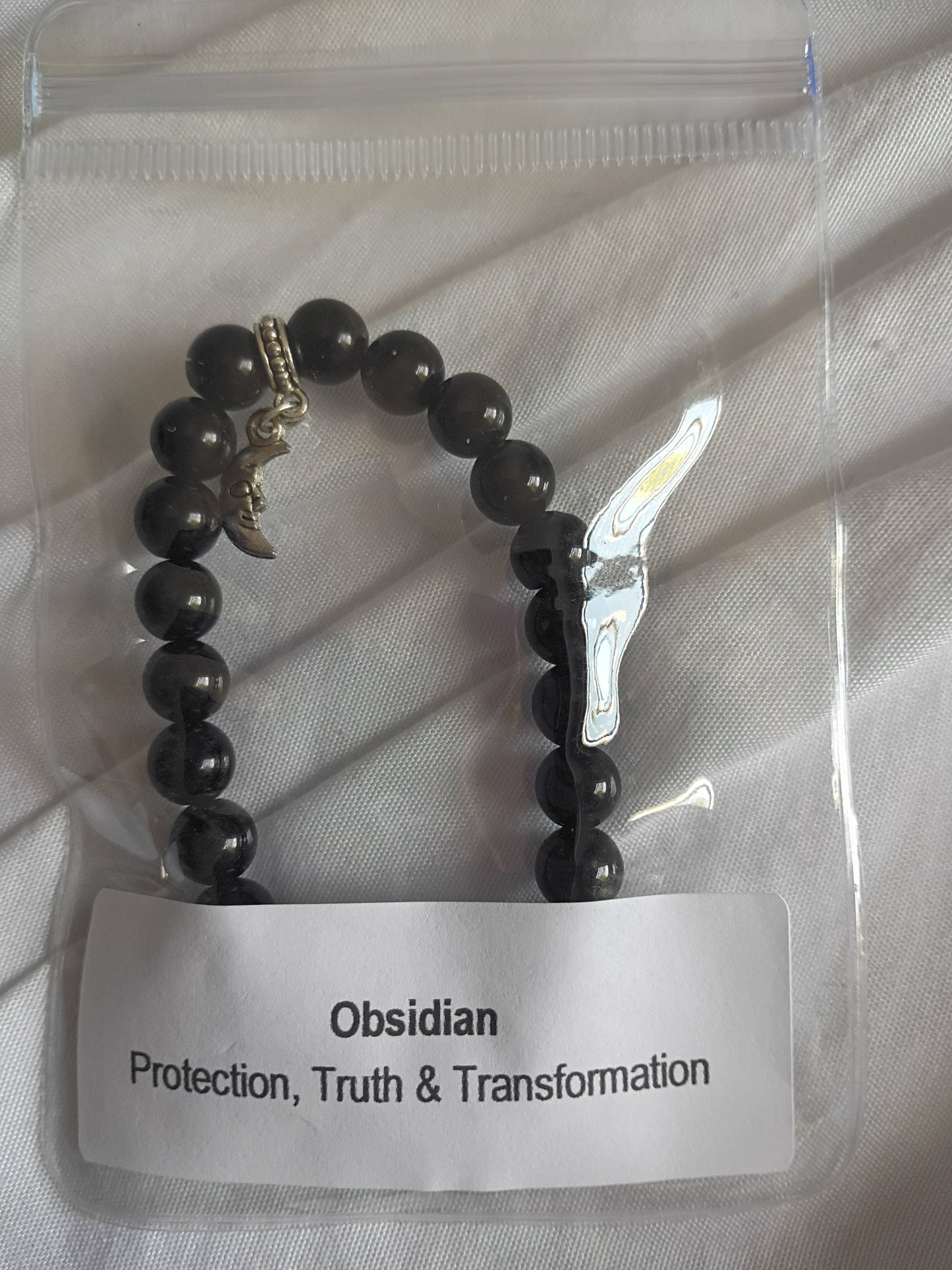 Obsidian energy bracelet with moon charm